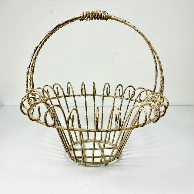Vintage Home is pleased to present this vintage French Art Nouveau Iron Basket Jardiniere Planter. We curated this...