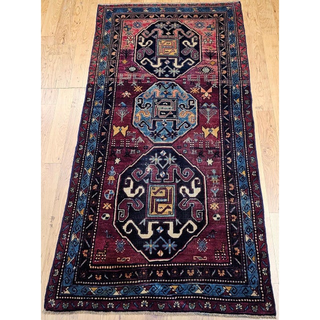 An enchanting late 19th Century Caucasian "Cloudband" Kazak area rug hand-woven in the village of Chondoresh in the...