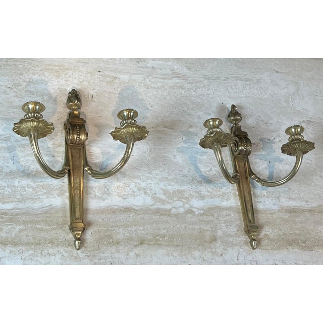 This pair of Louis XVI style sconces is made of bronze. It is a French work, finely chiseled. Circa 1900