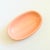 A vintage 1980s ceramic soap dish. Simple oval shape, finished in glossy light pink glaze. Embossed detailing along the...