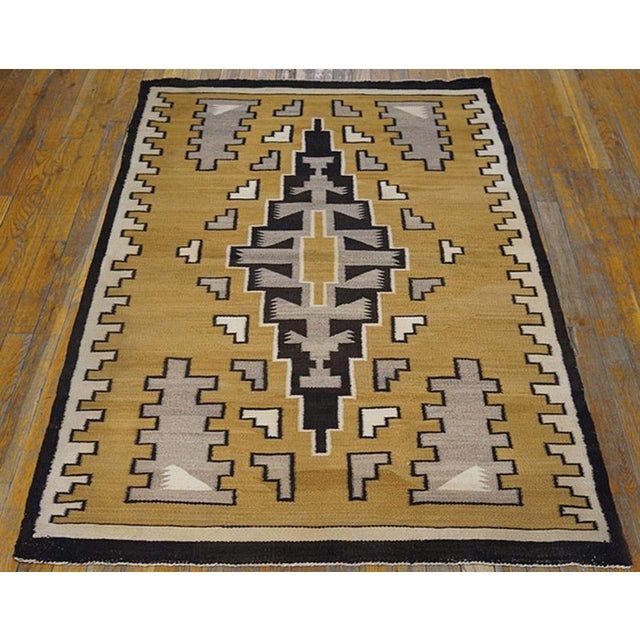 Antique Navajo American Brown 1930s Rug, Circa Date: 1930s. This exceptional example of American weaving tradition belongs...