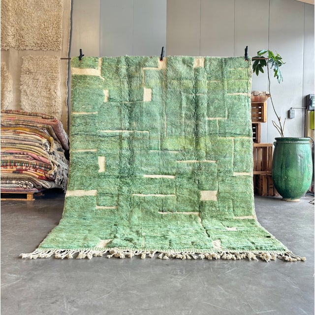 Handwoven in Morocco from premium natural wool, this contemporary Mrirt rug features a sophisticated geometric composition...