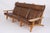 Hans j. Wegner modular living room set in natural oak and original brown leather. The system consists of three armchairs...