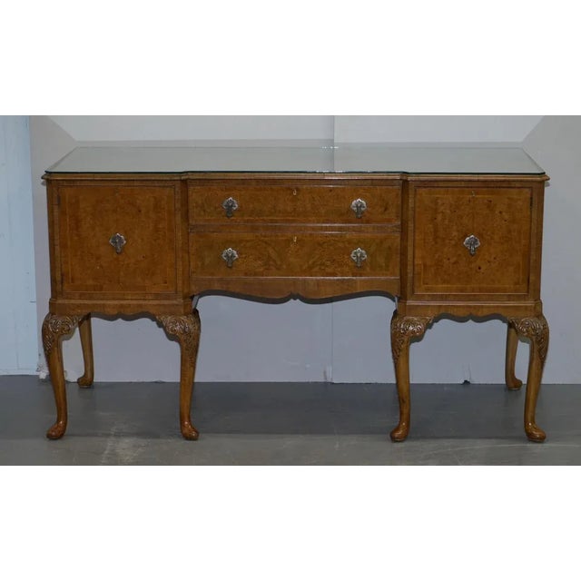 Stunning Denby & Spinks Leeds circa 1920 Art Deco Burr Walnut inverted breakfront sideboard which is part of a large...