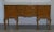 Stunning Denby & Spinks Leeds circa 1920 Art Deco Burr Walnut inverted breakfront sideboard which is part of a large...