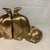 This pair of vintage brass cat bookends features stylized felines in a playful stretching or crouching pose with elevated...