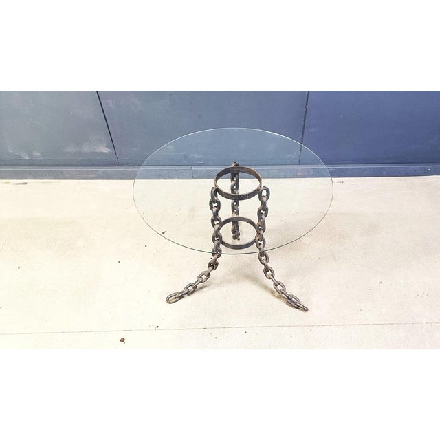 Industrial chain link coffee table or side table with a clear glass round table top. Cool contrasting 'heavy' looking item...