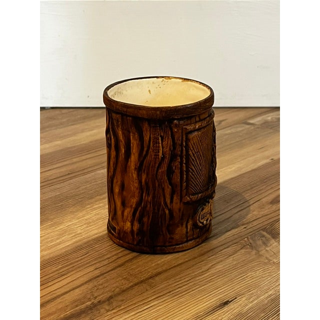 • Design: Brown glazed ceramic styled to look like carved wood or tree bark. • Artwork: An embossed image of Cinderella's...
