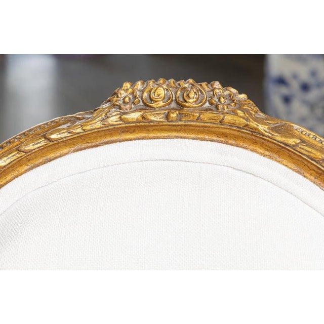 French Early 20th Century 0ne of a Pair of Identical Louis XVI Style Gilt Wood Armchairs For Sale - Image 3 of 7
