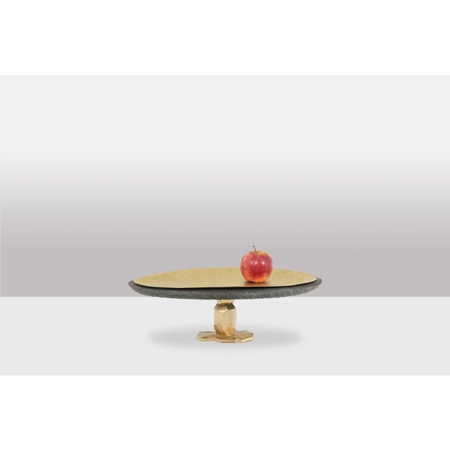 “Pitoin” bowl in hammered brass slate, glossy varnish and mineral wax finish. Work of a contemporary French artist. This...