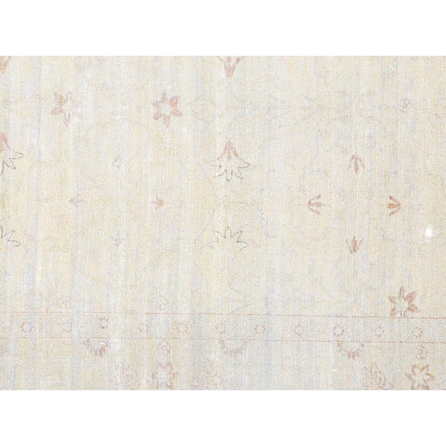 Woven in Egypt's Nile delta region using centuries-old techniques, this vintage Tabriz rug measures 7'8" x 9'6" and...