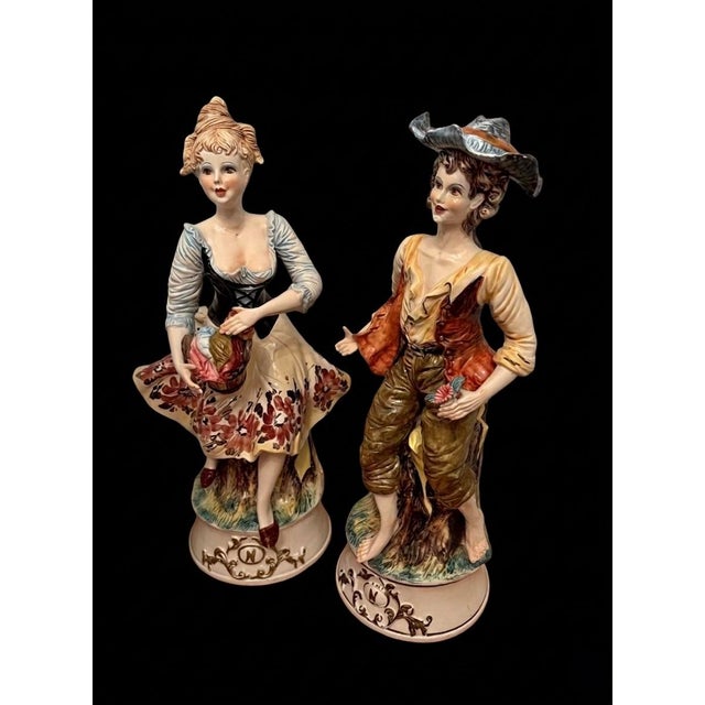 Elevate your interior with this rare, monumental pair of 28-inch Italian porcelain figurines in the classic Capodimonte...