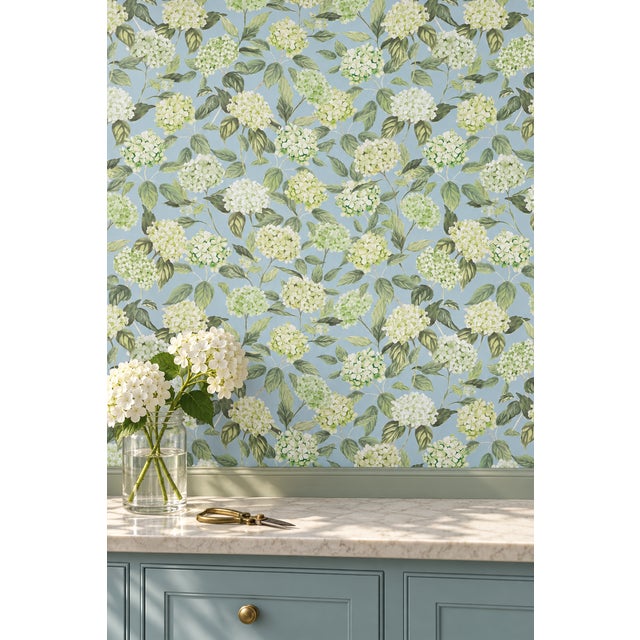 Our Hydrangea Blooms Botanical Wallpaper began as a hand-painted watercolor, with each petal added one by one to capture...