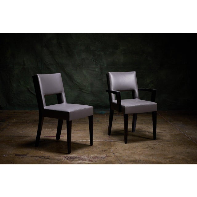 Dakota Jackson contemporary dining chairs, set of 12, upholstered in gray leather with matching upholstered backrests and...