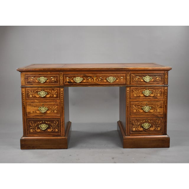 A good quality Victorian rosewood and marquetry writing, having a green leather writing surface, decorated with blind and...