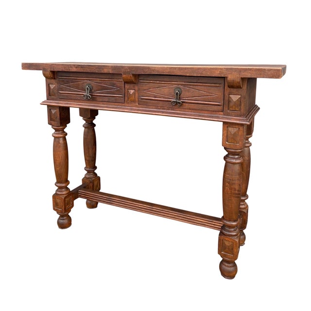 Elegant Spanish console table in the Renaissance Revival style, dating from the early 20th century. The piece features a...