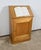 Solid blond walnut cabinet with a door with a large dark tab cutting frame in a single panel. On deported pivots, this...