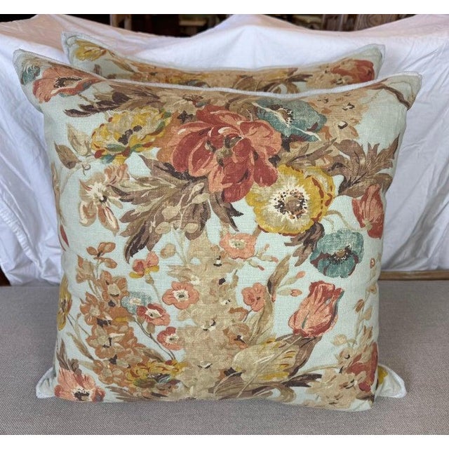 These decorative throw pillows feature a vintage-inspired floral design on a soft, muted background. The intricate pattern...