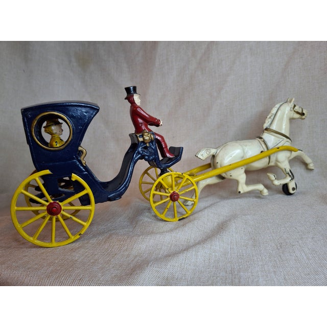 For your consideration is a remarkable, premium example of an authentic antique cast iron horse-drawn Cabriolet Hansom Cab...