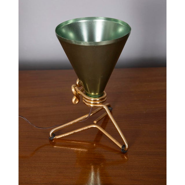 Table lamp with spiral-shaped gilded brass base and conical green metal diffuser, designed by Ettore Sottsass for...