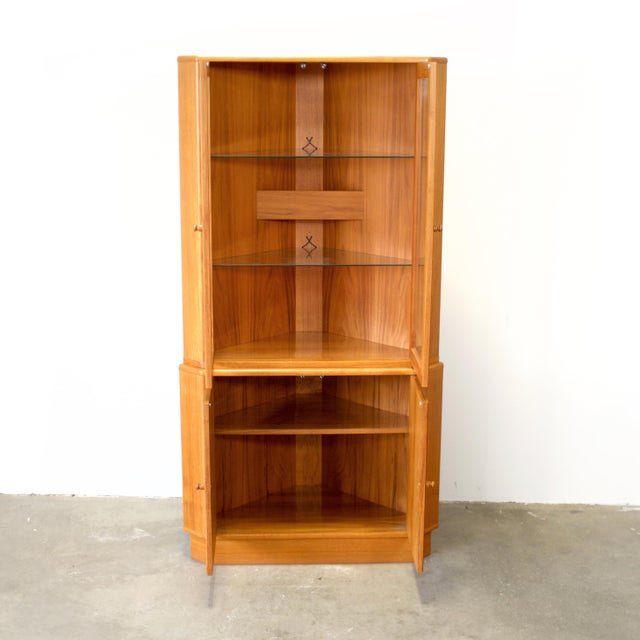 Dimensions: 24” L (wall) x 33 3/4” D (front) x 67” H Origin: Denmark Designer: Unknown Manufacturer: Unknown Year: ca...