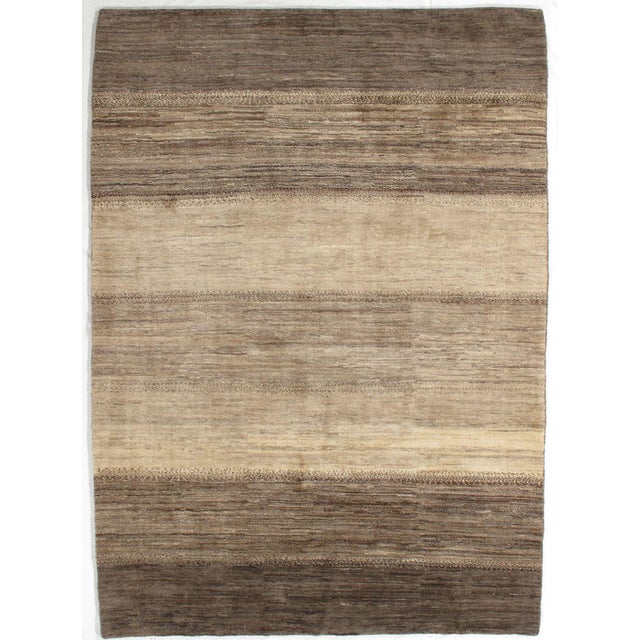 Vintage Hand-knotted Persian Lori Gabbeh rug featuring a soft, neutral palette with horizontal bands in shades of beige,...