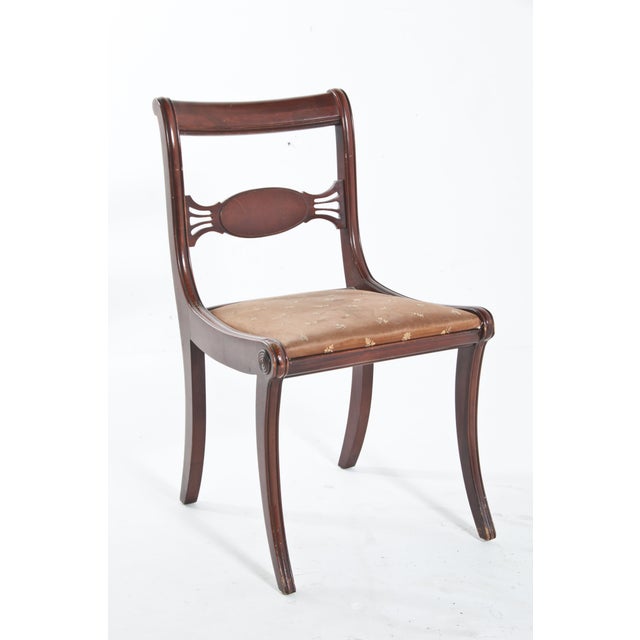 This Vintage Regency style side chair will look good in any room. Lovely carved and curved legs.