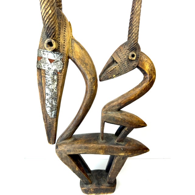 This exquisite Chi Wara headdress sculpture from Mali, West Africa, is a stunning example of traditional African artistry....