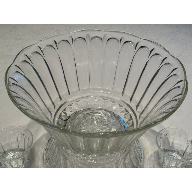 This 1960's Anchor Hocking punch bowl set is beautifully preserved. The large bowl measures 12" inches in diameter and 6"...