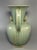 This is a premium antique Chinese Longquan celadon ewer with elegant spout and curved handle, decorated with delicate...
