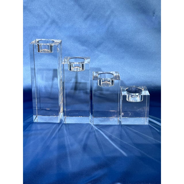 Set of 4 crystal tea light candle holder from the Bombay Company ranging from 3” to 7.5” in height. All in good shape and...