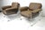 A pair of rare, sophisticated, upholstered leatherette and Lucite lounge chairs with large arms and loose cushions for...