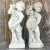 Vintage Boho Cast Concrete Season Statues - A Pair infuse your space with quintessential American style. These captivating...