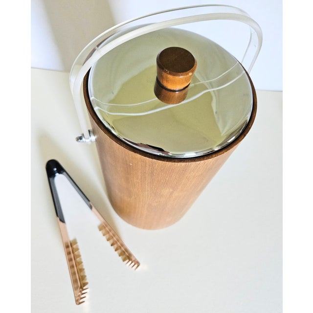 A 60s Retro Large Walnut and Chrome Thermos Glass Insulated Ice Bucket. it featires a Chrome dome lid with matching walnut...
