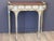 Demilune-form table with a mahogany top edged in a carved and gilt scrolling acanthus border, above a painted gray apron...