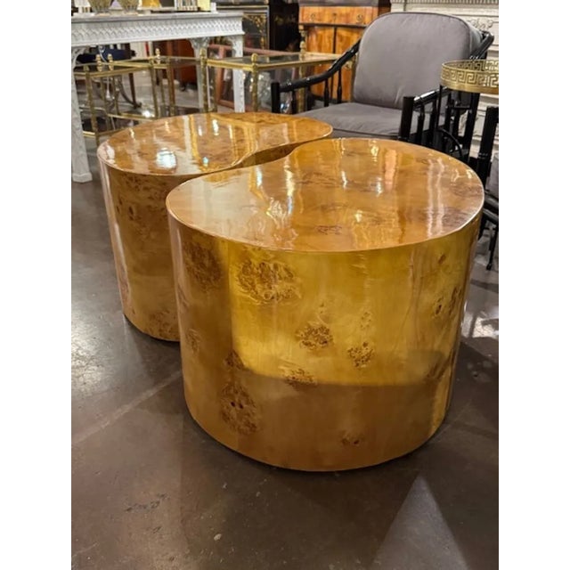 These modern kidney-shaped tables are reminiscent of the iconic designs by Milo Baughman, featuring a sleek and stylish...
