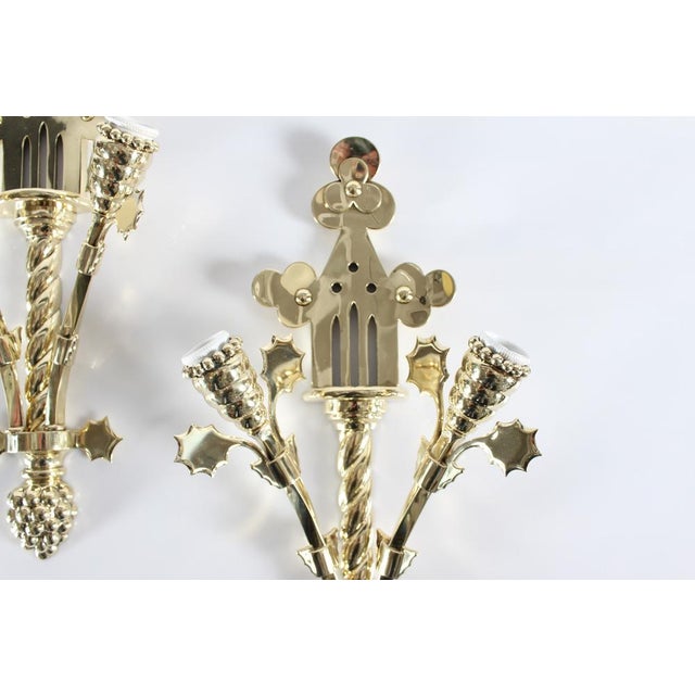 Pair of rare large Art Nouveau wall lights/wall sconces made of strong, heavy brass. They are made in Denmark 1890-1910 in...