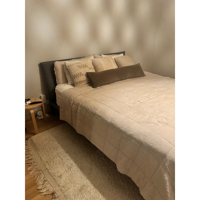 Beautiful upholstered pillow-back king bed from ABC Carpet & Home. The style is the Gallerist bed, with a soft, modern...