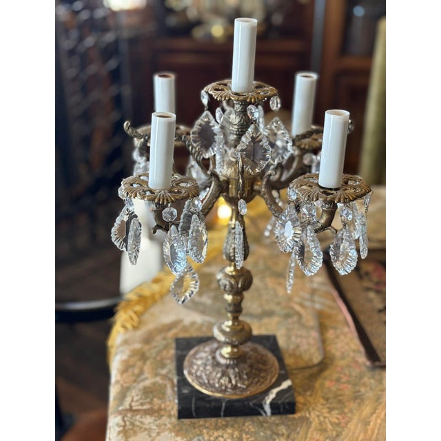 Elegant vintage marble and cast brass 5 arm electric candleabra with crystal embellishments. The main body of this lamp is...