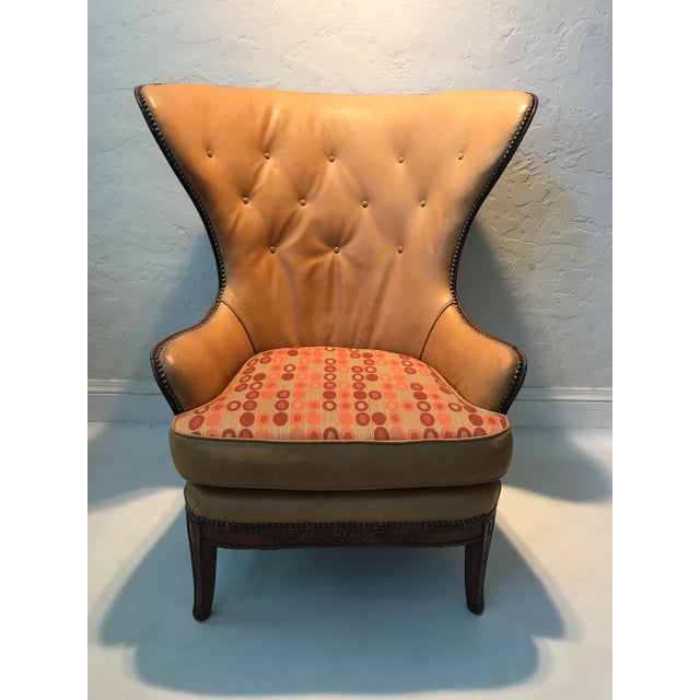 Vintage designer brass nailhead high-wingback chair, professionally upholstered and showcasing the original Knoll Custom...