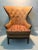 Vintage designer brass nailhead high-wingback chair, professionally upholstered and showcasing the original Knoll Custom...
