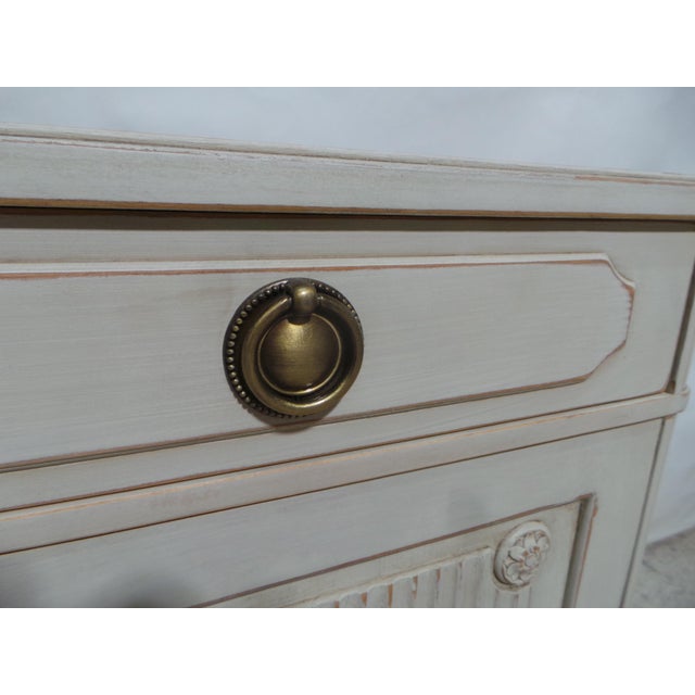 This is a unique 2 door 2 drawer Swedish Gustavian style sideboard .