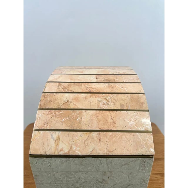 A striking Art Deco-style decorative box by Maitland-Smith, hand-crafted from tessellated pink marble in soft rose and...