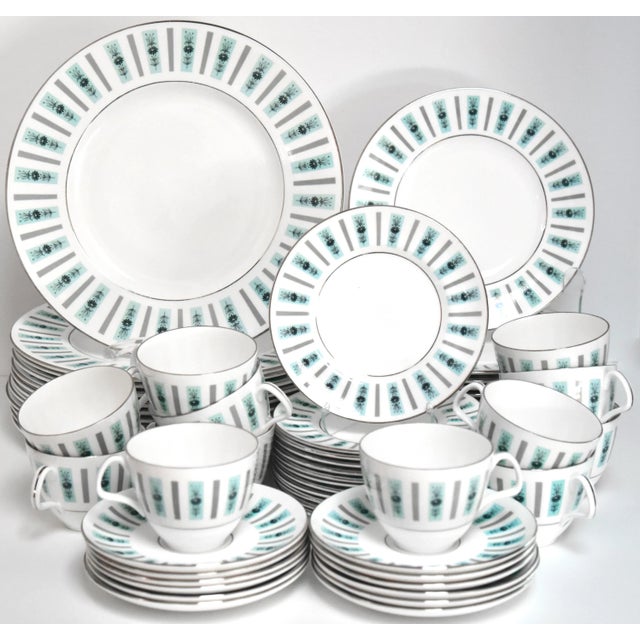 An English dinner service for twelve settings having an enchanting mid-century modern design of aqua and grey colour bands...
