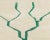 Artistic hand-knotted wool rug in a soothing Ivory background, showcasing a minimalist Jade Jubilee Green tree design....