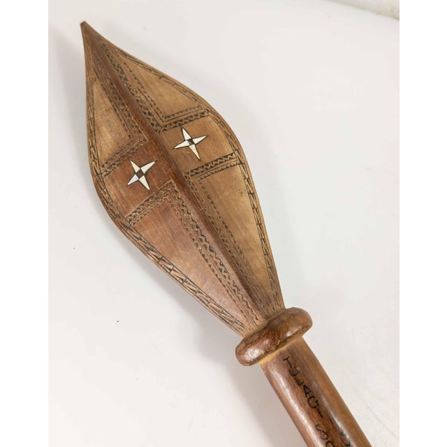 We are selling this interesting Mid-Century WWII era Solomon Island paddle. This carved hardwood paddle has carved...
