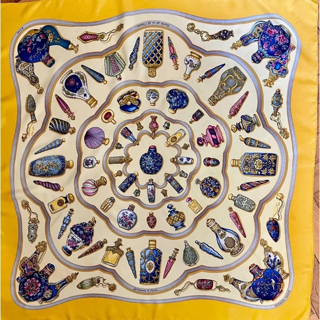Hermès Les Flacons 1988 yellow silk scarf This square scarf illustrates the quote by the famous writer Alfred de Musset,...