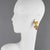Monique Vedié Paris designed these rare Talosel resin clip-on earrings. The pieces boast a geometric, dangling shape with...