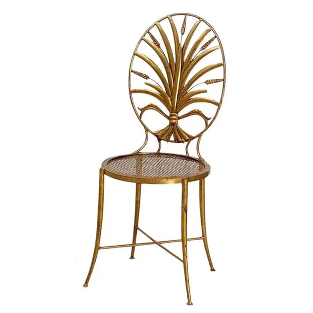 A lovely wheat sheaf chair by S. Salvadori - Firenze from the Hollywood Regency design era. Featuring an elegantly...