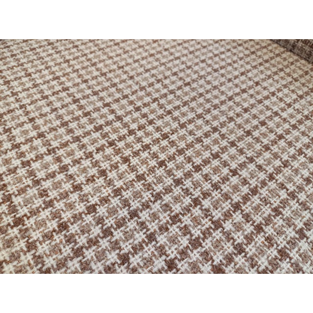 Large vintage armchair from the 1970s, seat, back, and armrests upholstered in checkered wool fabric in shades of beige,...